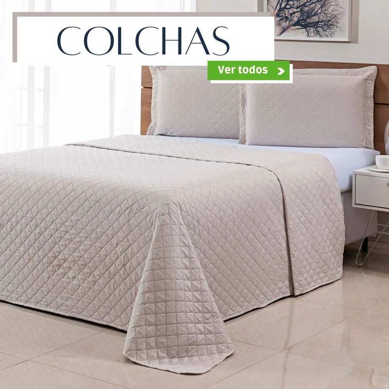 Banner exibindo colchas bege acolchoadas sobre uma cama, com o título "COLCHAS". O botão "Ver todos" direciona para a seleção completa de colchas, oferecendo opções para decoração e conforto.
